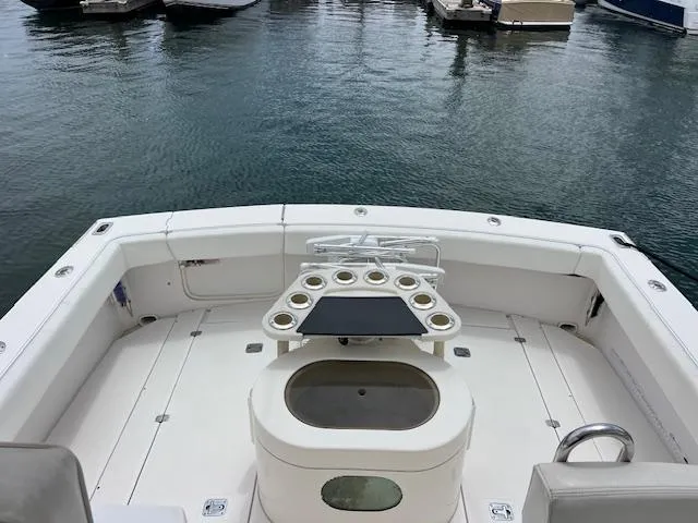 Slide: The Image of 1997 Blackfin 30.7 EXPRESS boat deck with fishing rod holders, docked in marina. - 13