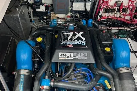 Slide: The Image of Engine compartment of a 1997 Blackfin 30.7 EXPRESS boat, featuring a powerful marine engine. - 7