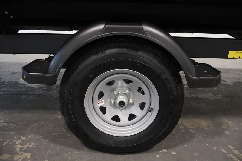 Slide: The Image of Trailer wheel of 2027 Sea-Doo Switch Cruise 21, featuring a sturdy tire and rim. - 40