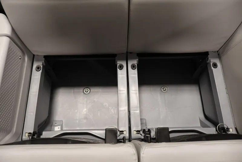 Slide: The Image of Under-seat storage compartments in 2027 Sea-Doo Switch Cruise 21 boat. - 29
