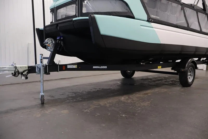 Slide: The Image of 2027 Sea-Doo Switch Cruise 21 on trailer in indoor setting. - 30