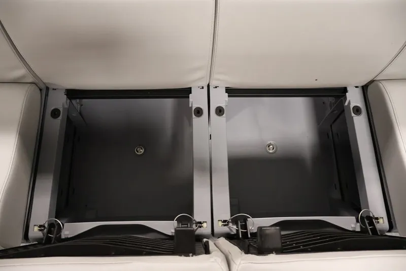 Slide: The Image of Under-seat storage compartments in 2027 Sea-Doo Switch Cruise 21 boat. - 24