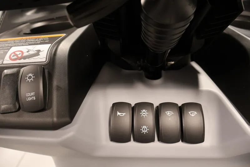 Slide: The Image of Control panel of 2027 Sea-Doo Switch Cruise 21 with various switches and buttons. - 27