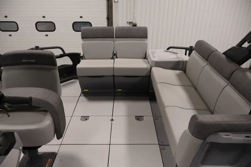 Slide: The Image of 2027 Sea-Doo Switch Cruise 21 interior with gray seating and spacious layout. - 34