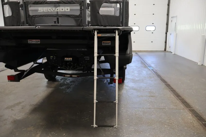 Slide: The Image of 2027 Sea-Doo Switch Cruise 21 with ladder in a garage setting. - 35