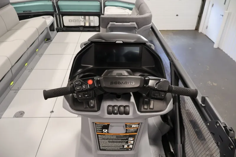 Slide: The Image of 2027 Sea-Doo Switch Cruise 21 dashboard with steering controls and seating area. - 19