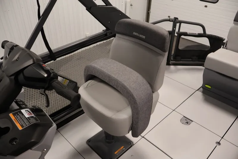 Slide: The Image of 2027 Sea-Doo Switch Cruise 21 interior with steering console and cushioned seating. - 21