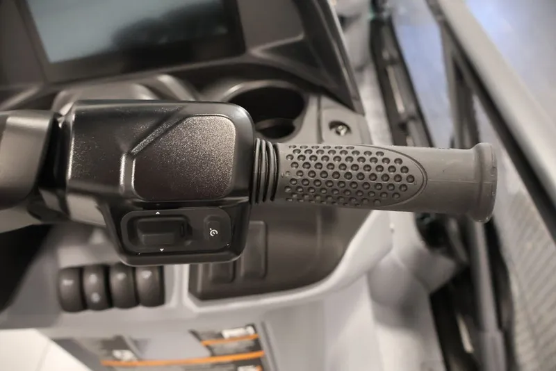 Slide: The Image of Close-up of 2027 Sea-Doo Switch Cruise 21 handlebar with control buttons. - 16