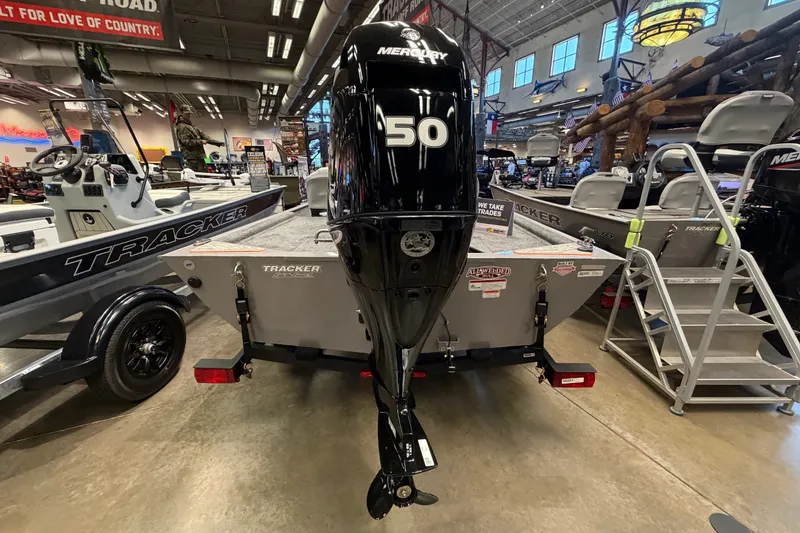 Slide: The Image of 2027 Tracker Bass Tracker Classic Limited boat with Mercury 50 engine in showroom. - 36