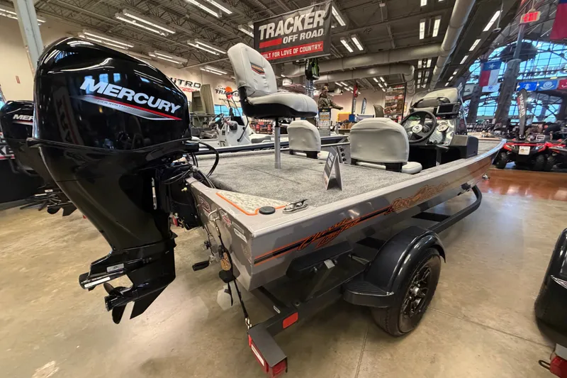Slide: The Image of 2027 Tracker Bass Tracker Classic Limited boat with Mercury engine in showroom. - 37