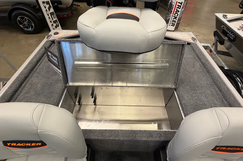 Slide: The Image of 2027 Tracker Bass Tracker Classic Limited boat interior with gray seating and storage compartment. - 44