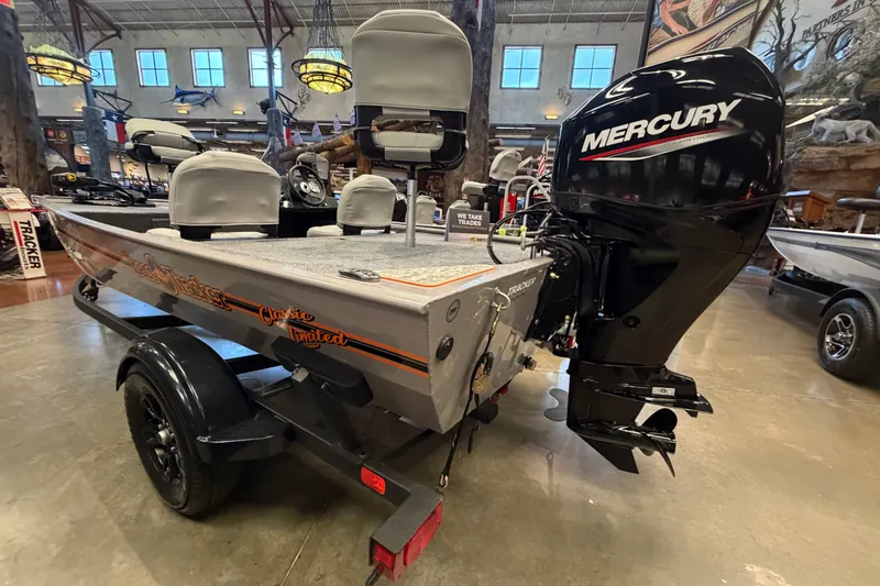 Slide: The Image of 2027 Tracker Bass Tracker Classic Limited boat with Mercury engine in showroom. - 35