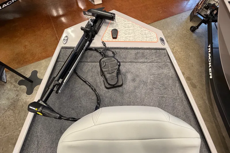 Slide: The Image of 2027 Tracker Bass Tracker Classic Limited boat interior with trolling motor and foot pedal. - 41