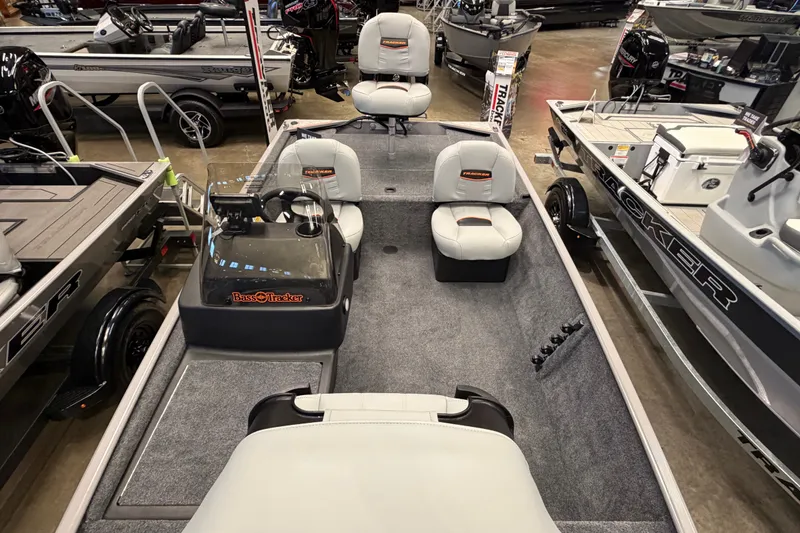 Slide: The Image of 2027 Tracker Bass Tracker Classic Limited boat interior with seating and steering console. - 42