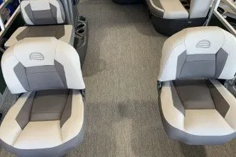 Slide: The Image of 2027 Sun Tracker Bass Buggy 16 XL Select boat seats, featuring gray and white upholstery. - 14