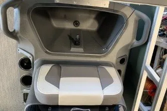 Slide: The Image of 2027 Sun Tracker Bass Buggy 16 XL Select interior seating and storage compartment. - 13