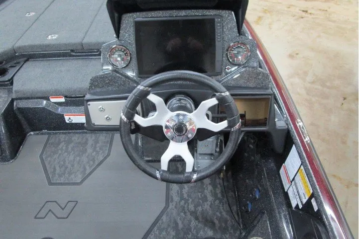 Slide: The Image of 2026 Nitro Z21 XL Pro boat dashboard with steering wheel and digital display. - 6