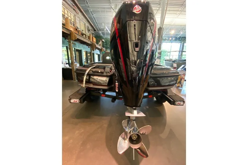 Slide: The Image of 2026 Nitro Z21 XL Pro boat with powerful outboard motor in showroom. - 8