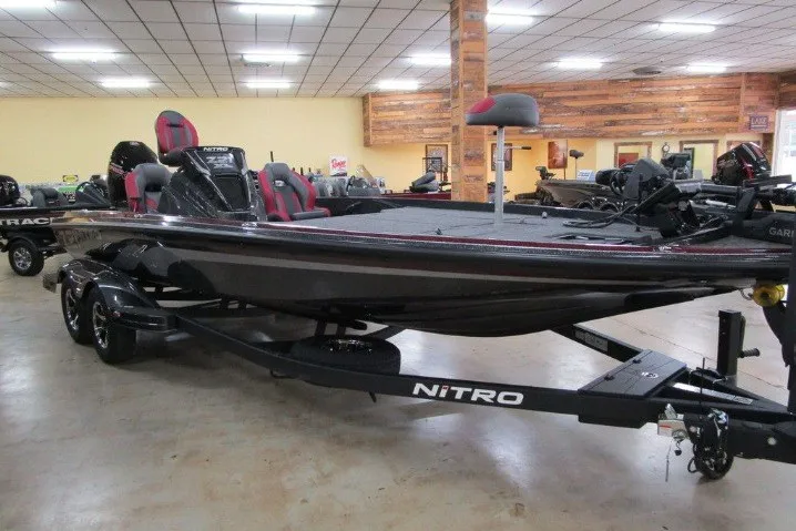 Slide: The Image of 2026 Nitro Z21 XL Pro boat displayed indoors on a trailer. - 2