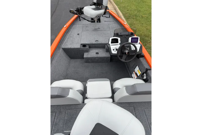 Slide: The Image of 2027 Tracker Pro Team 175 boat interior with steering console and seating. - 14