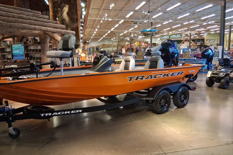 The Image of 2027 Tracker Pro Team 195 boat displayed in a showroom with bright lighting. - 0