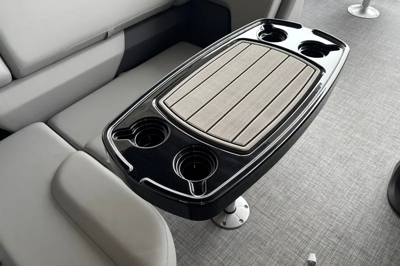 Slide: The Image of Interior of 2027 Sun Tracker SportFish 20 DLX with sleek table and cup holders. - 19