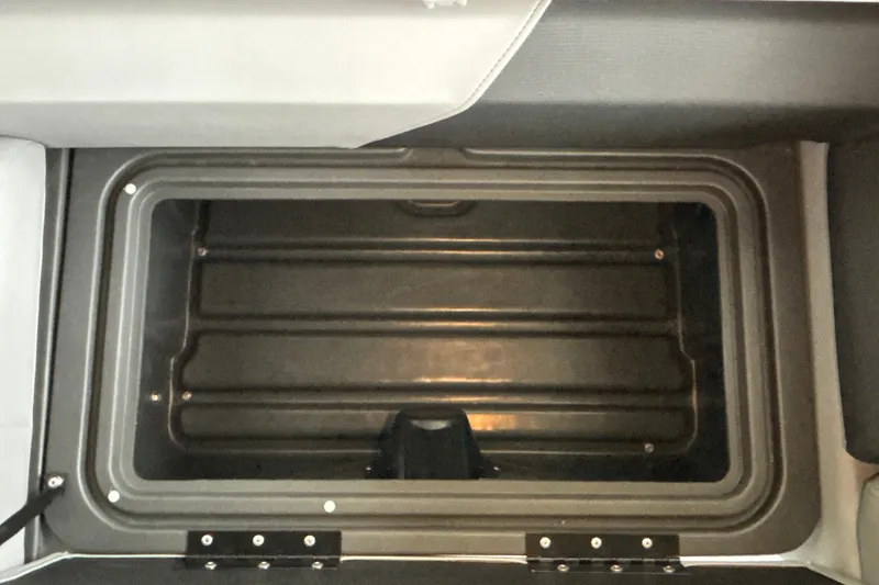 Slide: The Image of Storage compartment of 2027 Sun Tracker SportFish 20 DLX boat, open and empty. - 31