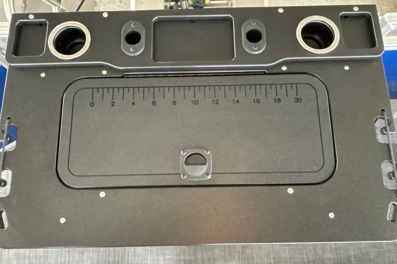Slide: The Image of 2027 Sun Tracker SportFish 20 DLX boat console with integrated ruler and cup holders. - 27