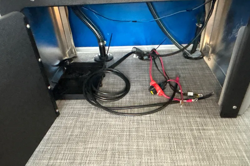 Slide: The Image of Interior wiring of 2027 Sun Tracker SportFish 20 DLX boat, showcasing cables and connections. - 40