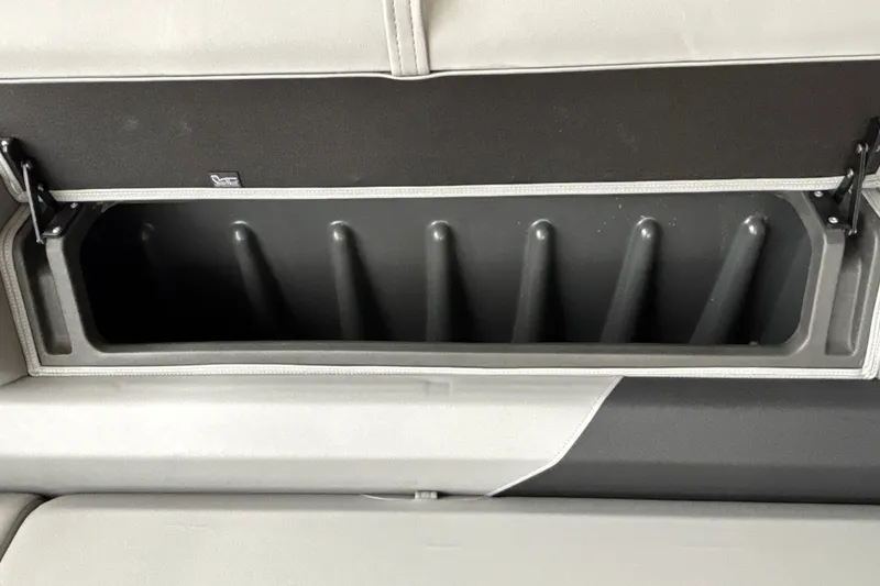 Slide: The Image of 2027 Sun Tracker SportFish 20 DLX rod storage compartment, featuring secure holders and sleek design. - 35