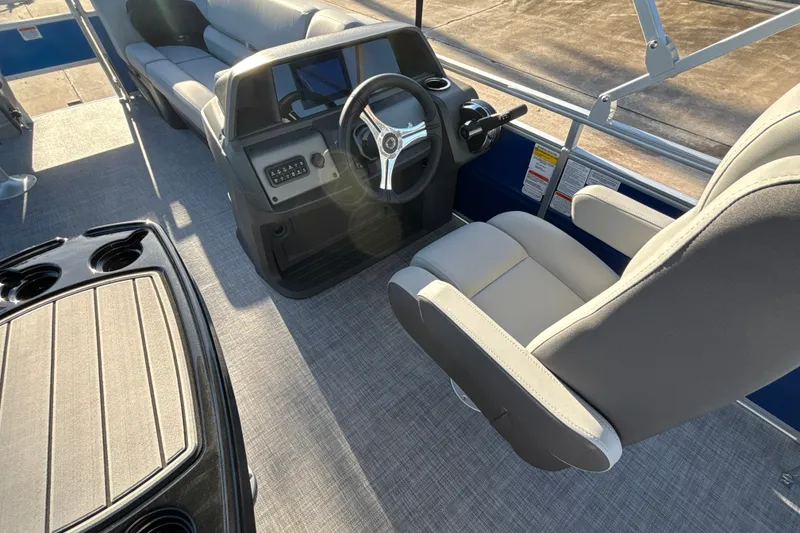 Slide: The Image of 2027 Sun Tracker SportFish 20 DLX boat interior with steering console and seating. - 21
