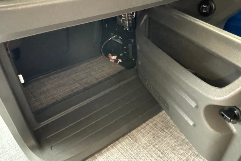 Slide: The Image of Interior storage compartment of 2027 Sun Tracker SportFish 20 DLX boat. - 33