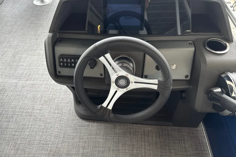 Slide: The Image of Steering console of 2027 Sun Tracker SportFish 20 DLX boat with modern controls. - 24