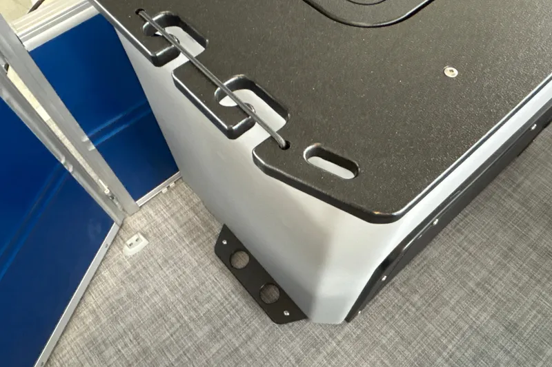 Slide: The Image of 2027 Sun Tracker SportFish 20 DLX boat interior detail with blue panel and textured flooring. - 26