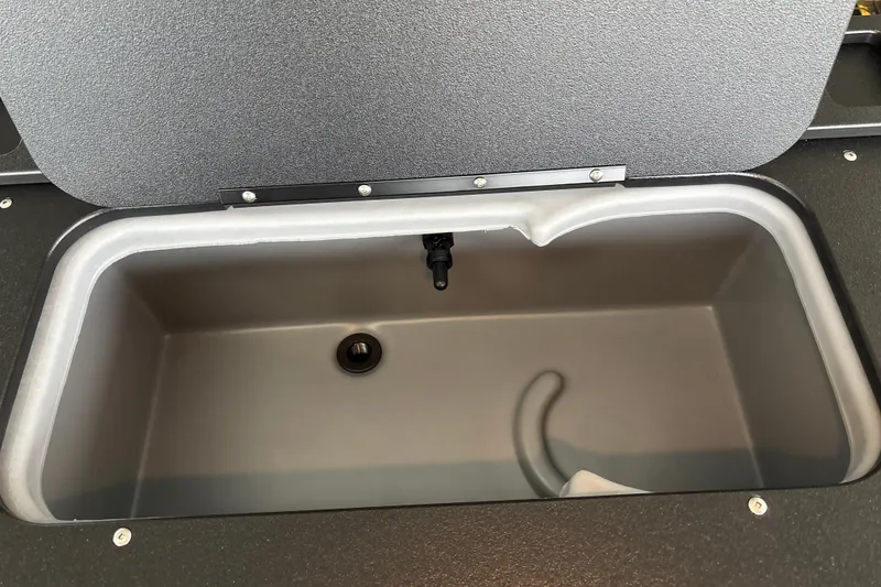 Slide: The Image of Livewell compartment in 2027 Sun Tracker SportFish 20 DLX boat, open lid view. - 28