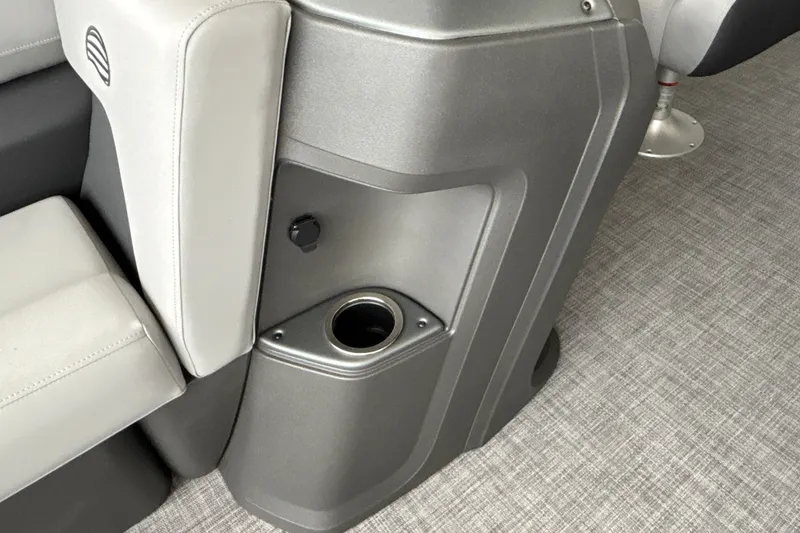 Slide: The Image of Interior of 2027 Sun Tracker SportFish 20 DLX boat, featuring a sleek cup holder. - 13