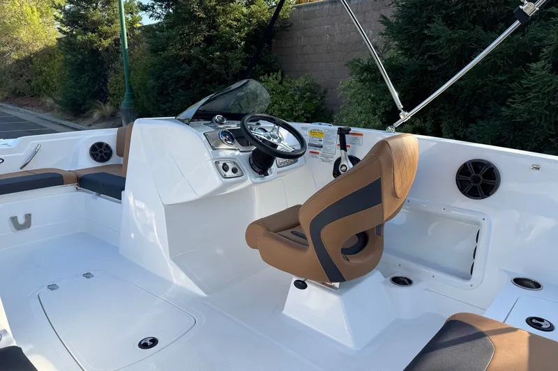 Slide: The Image of Interior of a 2027 Tahoe 1950 boat with modern steering and seating. - 12