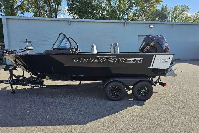 The Image of 2027 Tracker Targa V-18 Combo boat on trailer, parked outdoors. - 0