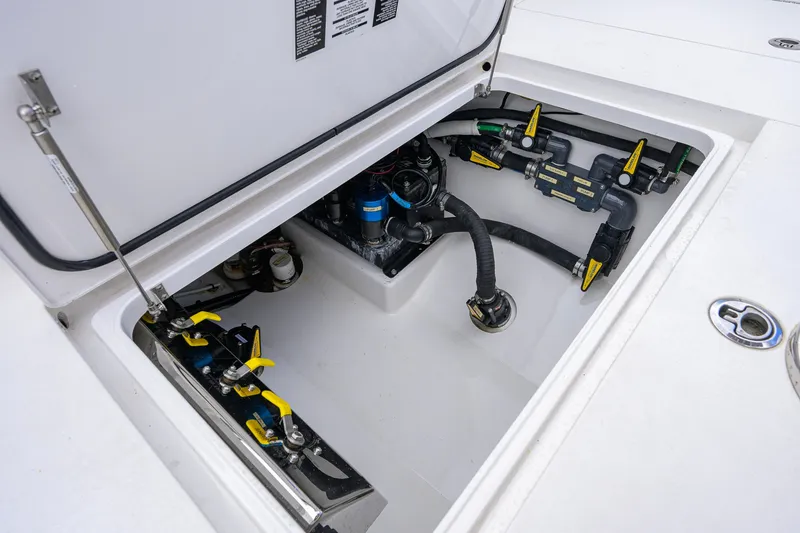 Slide: The Image of Open hatch of 2021 Valhalla V-41 boat showing internal mechanical components and piping. - 66
