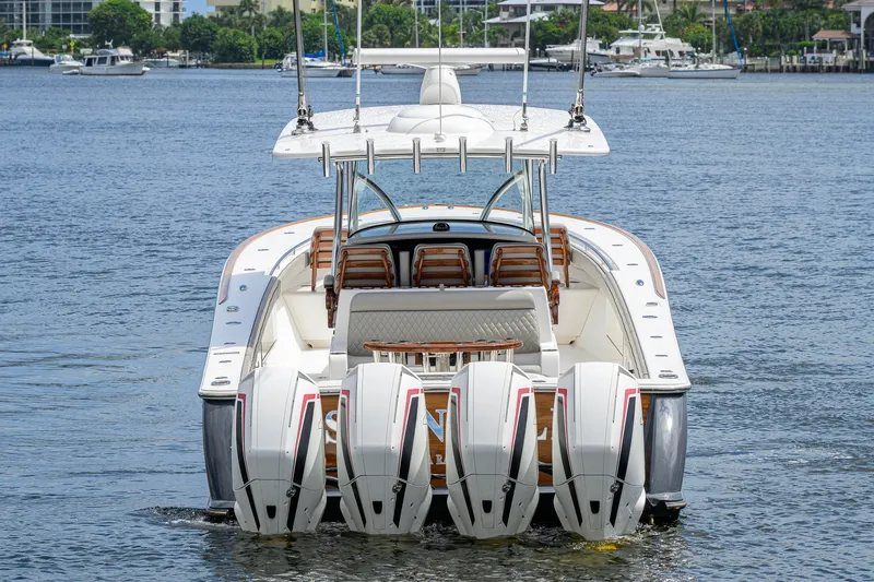 Slide: The Image of 2021 Valhalla V-41 boat with four powerful outboard engines on the water. - 15