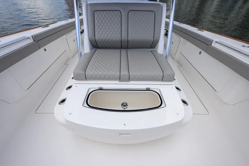 Slide: The Image of 2021 Valhalla V-41 boat interior with cushioned seating and storage compartment. - 57