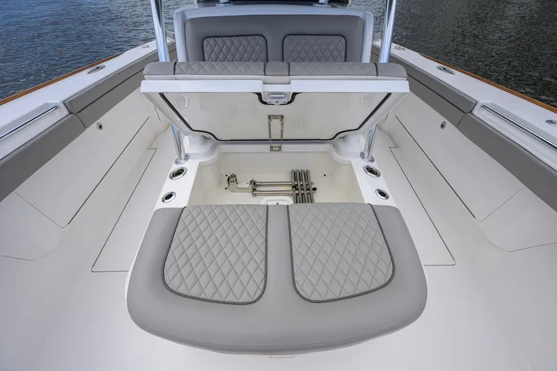 Slide: The Image of 2021 Valhalla V-41 boat interior with open storage compartment and quilted seating. - 58