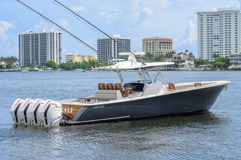 Slide: The Image of 2021 Valhalla V-41 boat with four engines on a sunny waterfront. - 14