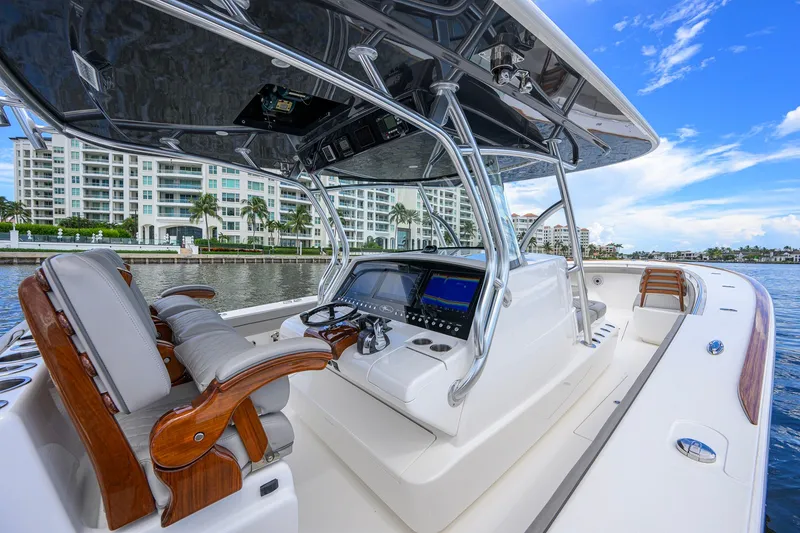 Slide: The Image of 2021 Valhalla V-41 boat interior with luxurious seating and modern dashboard. - 42