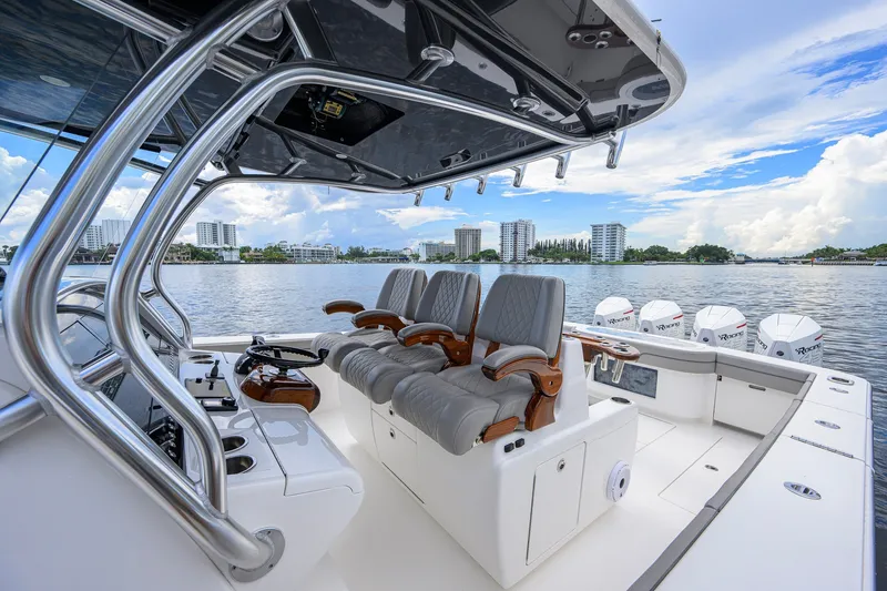 Slide: The Image of Luxury Valhalla V-41 boat interior with plush seating, overlooking a scenic waterfront. - 38