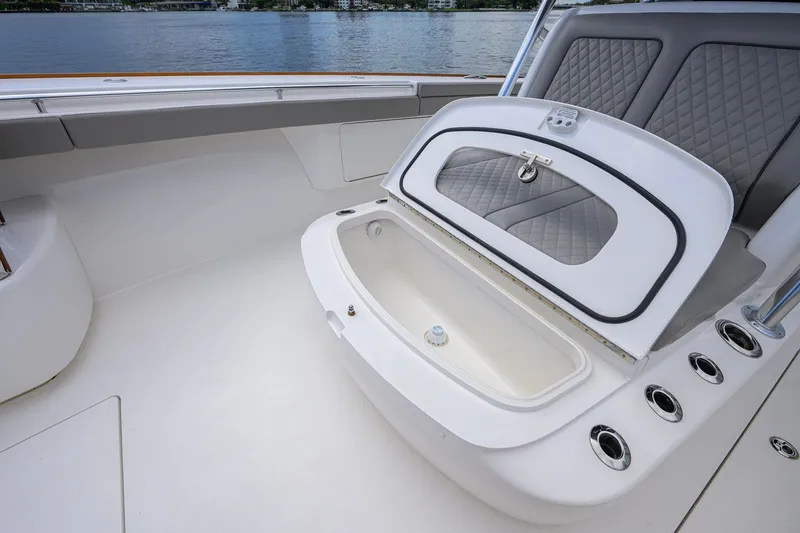 Slide: The Image of Valhalla V-41 2021 boat interior with open storage compartment and quilted seating. - 60