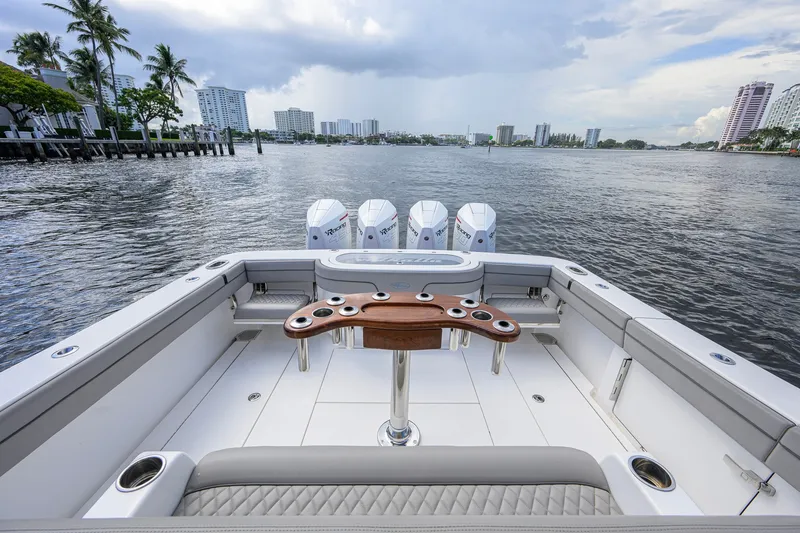 Slide: The Image of 2021 Valhalla V-41 boat with quad engines, spacious deck, and scenic waterfront view. - 24