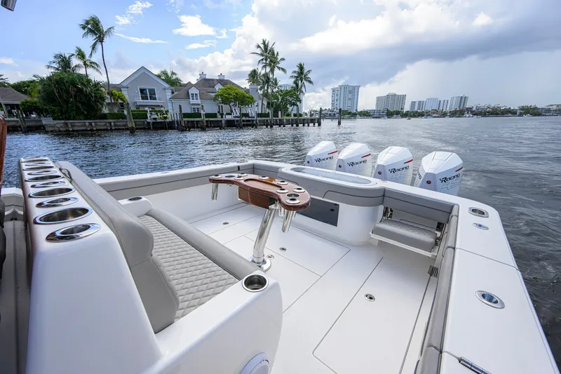 Slide: The Image of Luxurious 2021 Valhalla V-41 boat with quad engines, docked near waterfront homes. - 27