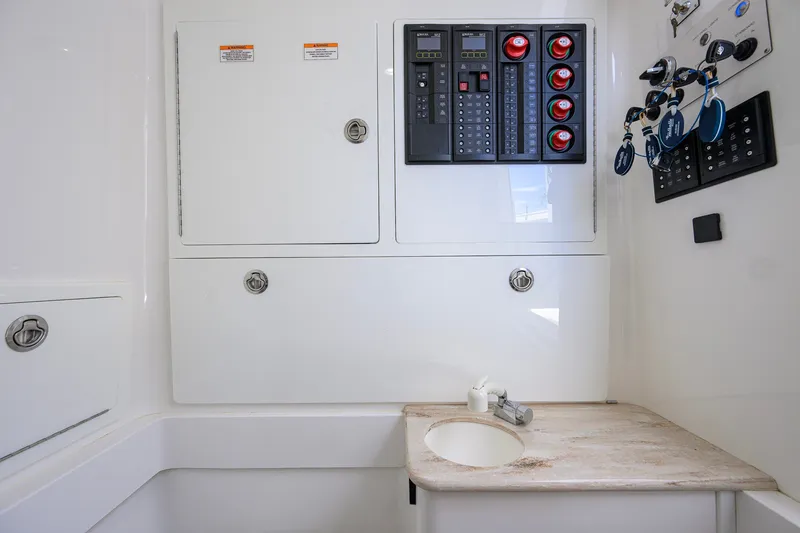 Slide: The Image of Electrical panel and sink area in 2021 Valhalla V-41 boat interior. - 74