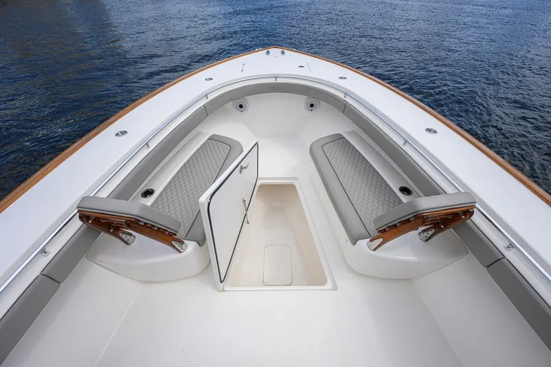Slide: The Image of Valhalla V-41 2021 boat interior with cushioned seating and storage compartment. - 52